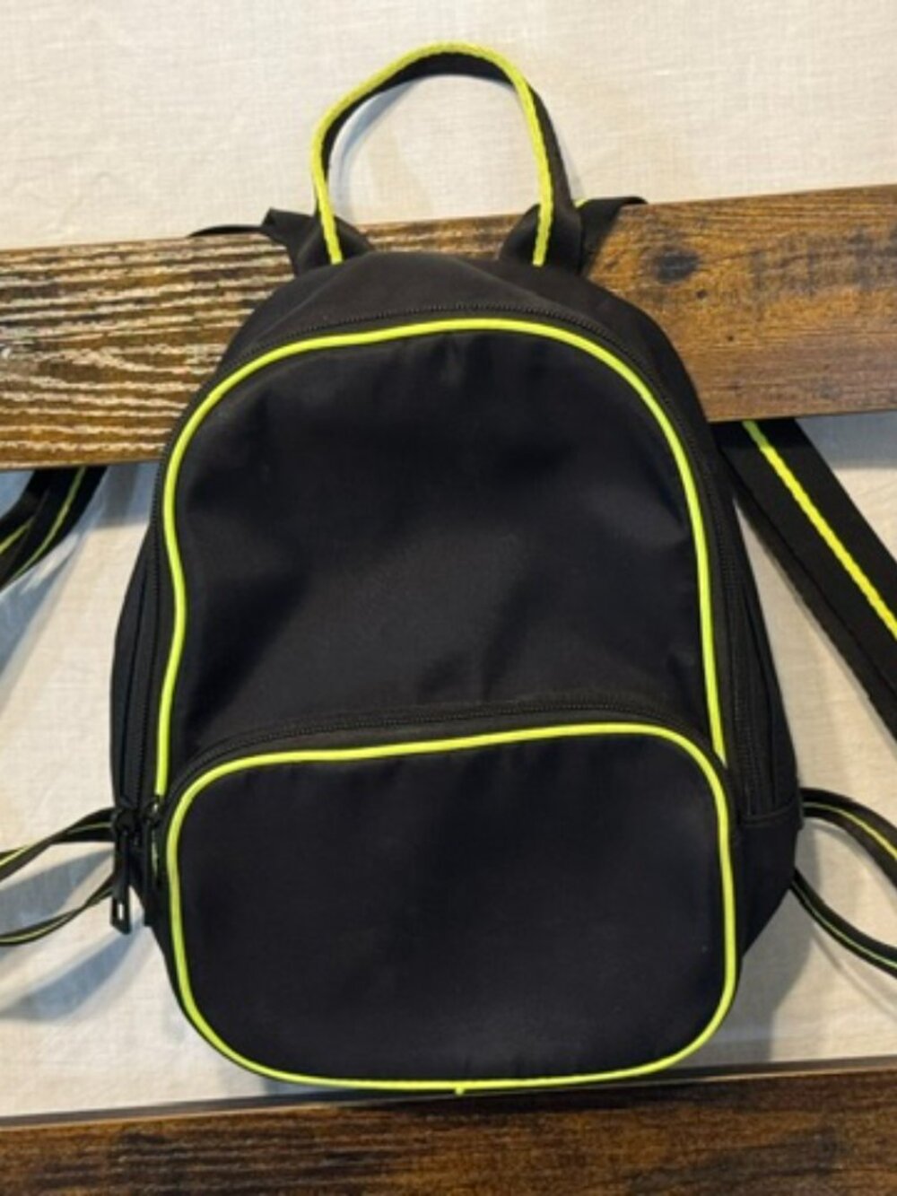 Small black and green backpack.